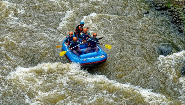 people riding on inflatable boat